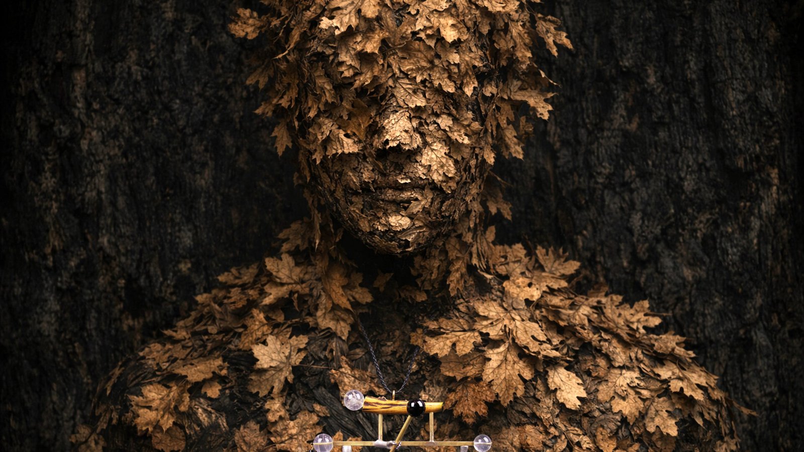 Wearable art jewelry from the Hunter Collection shown on a humanoid totem, expressing impact.