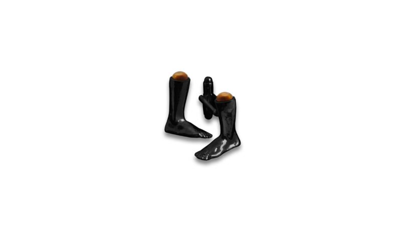 Black varnish contemporary jewellery sculpture from the MILIUS collection, Emergence III — Contained Force, minimalist anatomical form with semi-precious stone detail, conceptual jewellery design.