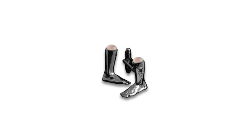 Ruthenium plated sculptural jewellery from the MILIUS collection, Emergence III — Contained Force, dark reflective anatomical form with semi-precious stone insert, contemporary art jewellery.