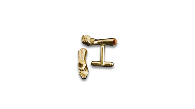 Gold plated version of Milius Act II Piece 03 “Retention Point I” with amber insert, conceptual cufflinks combining reflective metal, vertical containment, and held tension.