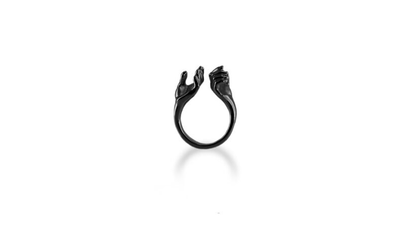 Black varnish finish of Milius Act III Piece 01 “Bearing Hands,” sculptural ring emphasising gravity, responsibility, and absorbed consequence.