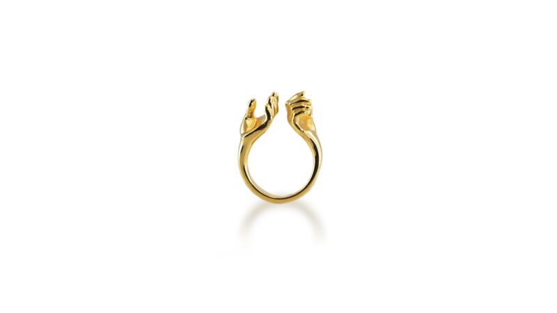 Gold plated finish of Milius Act III Piece 01 “Bearing Hands,” sculptural ring transforming consequence into permanence and value.