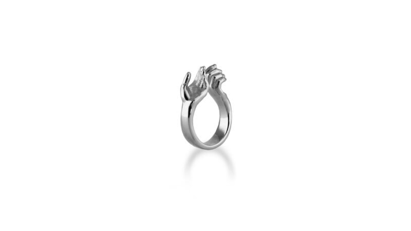 Palladium plated finish of Milius Act III Piece 01 “Bearing Hands,” reflective sculptural ring emphasising balance, presence, and resolved action.