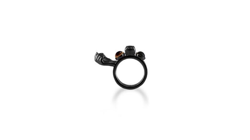 Black varnish finish of Milius Act III Piece 02 “Loaded Continuum,” sculptural ring emphasising density, compression, and absorbed consequence.