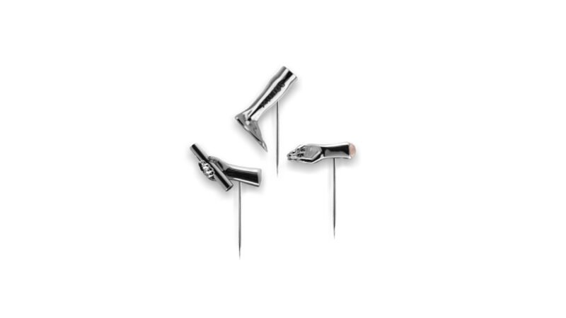 Milius Act III Transmission Distributed Omen palladium plated pin system with neutral metallic finish emphasising structural balance and dispersion
