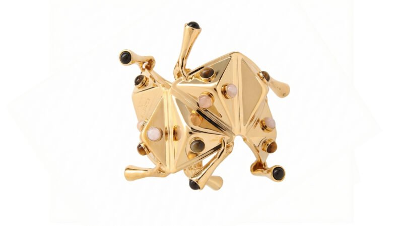 MILIUS - FIXATION architectural cuff in gold galvanised finish with semi-precious stones, angled view.