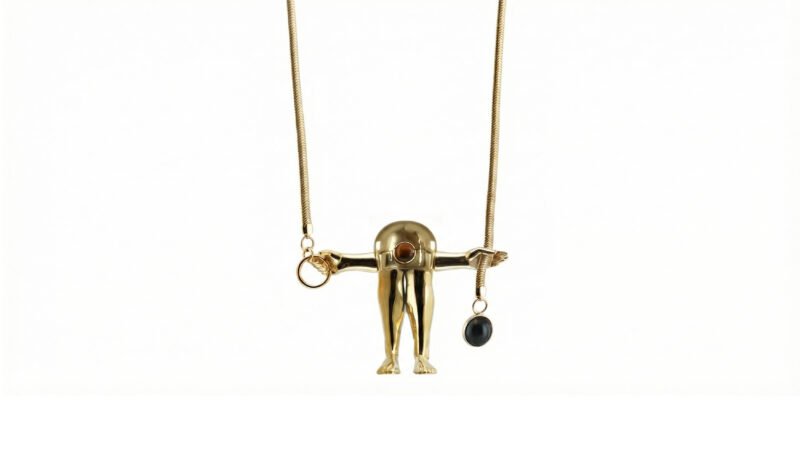 FIGURE necklace in gold finish from Milius exclusive Luisa Via Roma collection with tiger eye and onyx details.