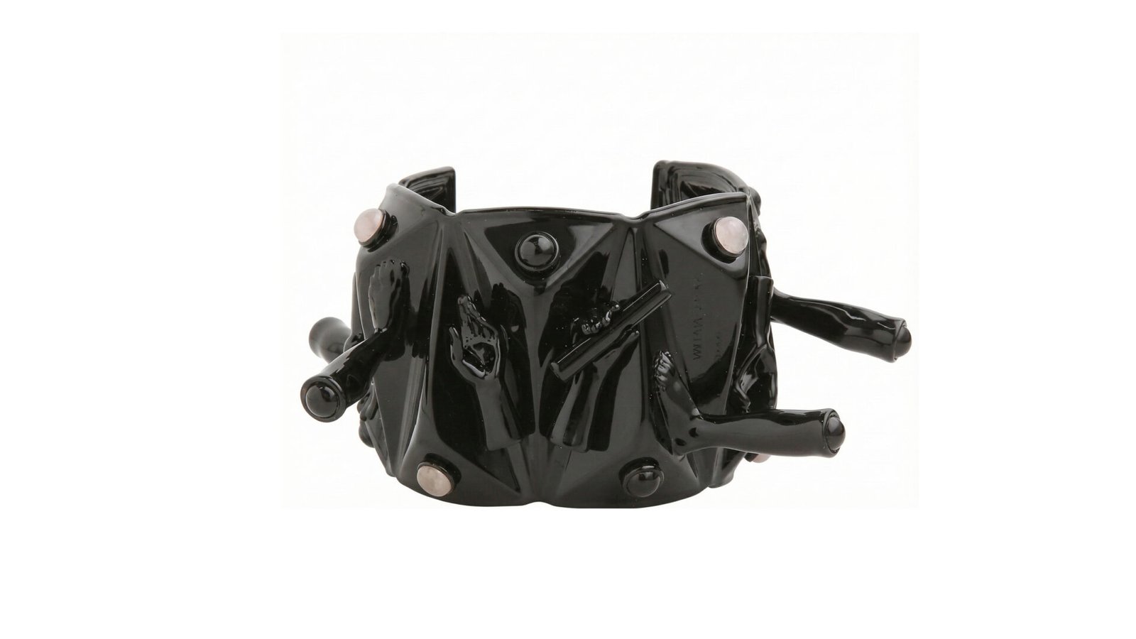 Black varnished sculptural COMPRESSION cuff bracelet by Milius with geometric reliefs, embedded stones, and protruding hand-formed elements.