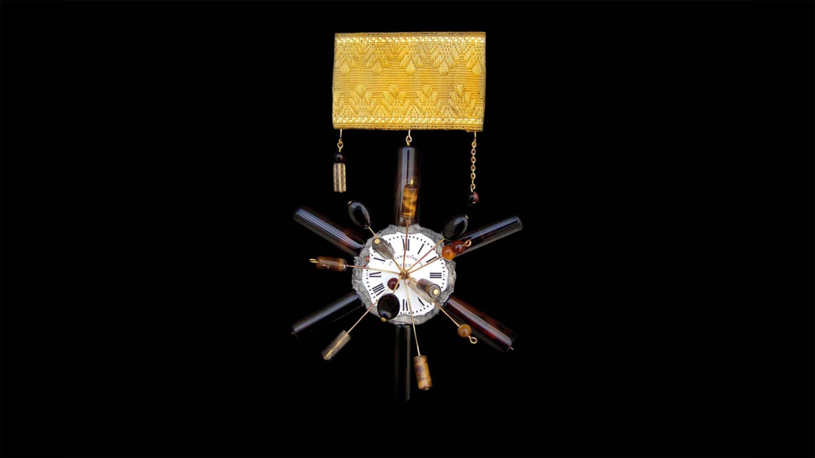 Time Collection Series V jewelry piece 5 on black background, kinetic wearable sculpture. Ceremonial pin from the Time Collection with metal and textile elements