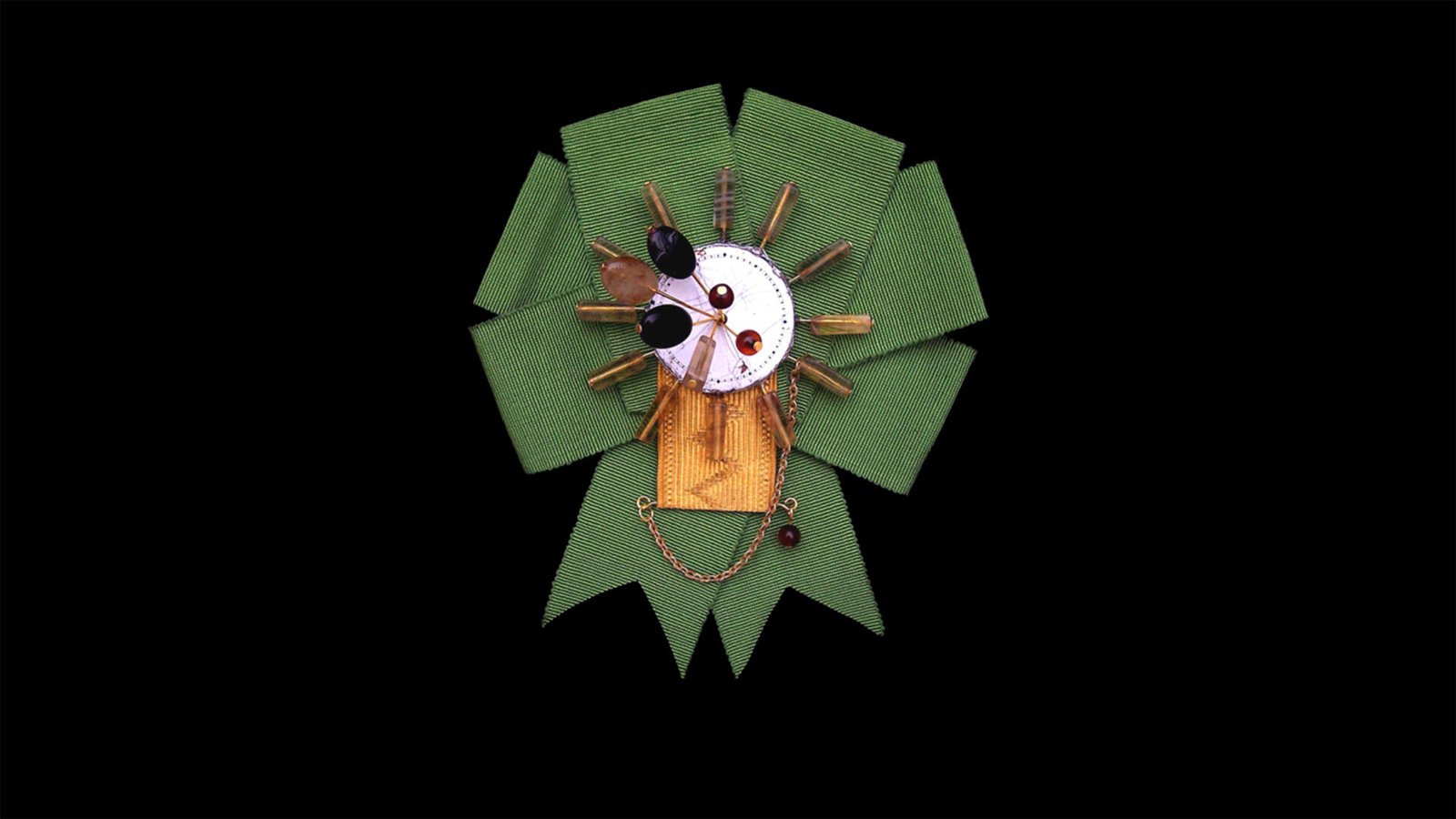 Temporal insignia pin handcrafted in Florence Time Collection Series II jewelry piece 3 isolated on black background, radial organic wearable time sculpture