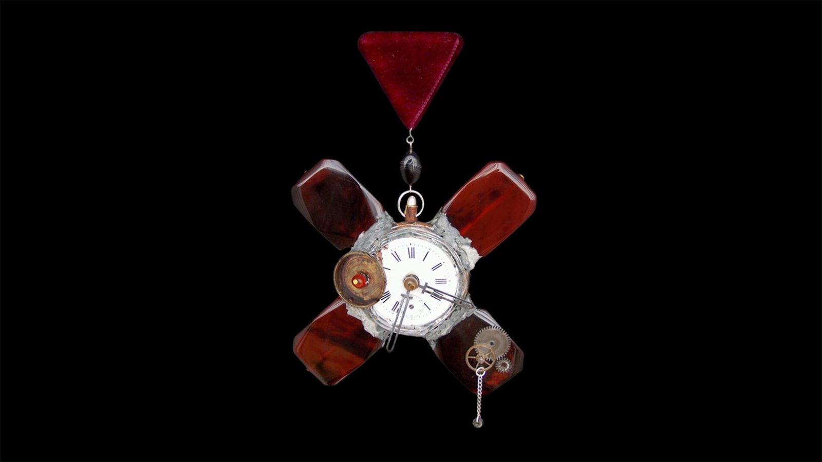 Time Collection Series III jewelry piece 5 isolated on black background, suspended wearable time artifact