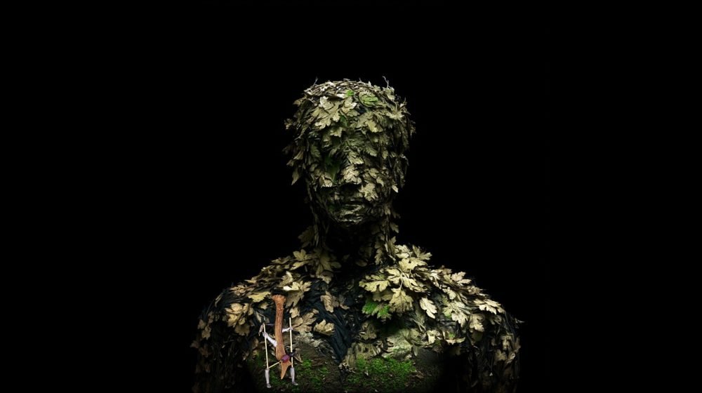 Wearable art jewelry from the Hunter Collection integrated into a humanoid totem, expressing pressure transformed into structure.