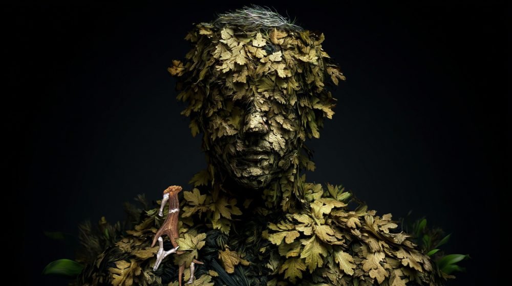 Wearable art jewelry from the Hunter Collection shown on a humanoid botanical totem, expressing first contact.