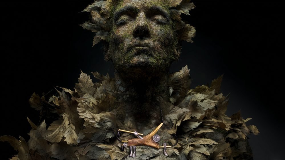 Wearable art jewelry from the Hunter Collection shown on a humanoid totem, exploring silent orientation.