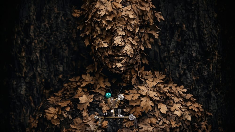Applied anthropology jewelry from the Hunter Collection worn on a humanoid totem, expressing ritual orientation.